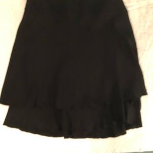 Vintage Black Chanel knee length skirt w/ CC adornment@waist, tiered  hem